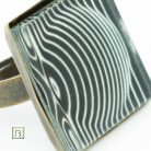 Op-art fekete alapú kör gyűrű